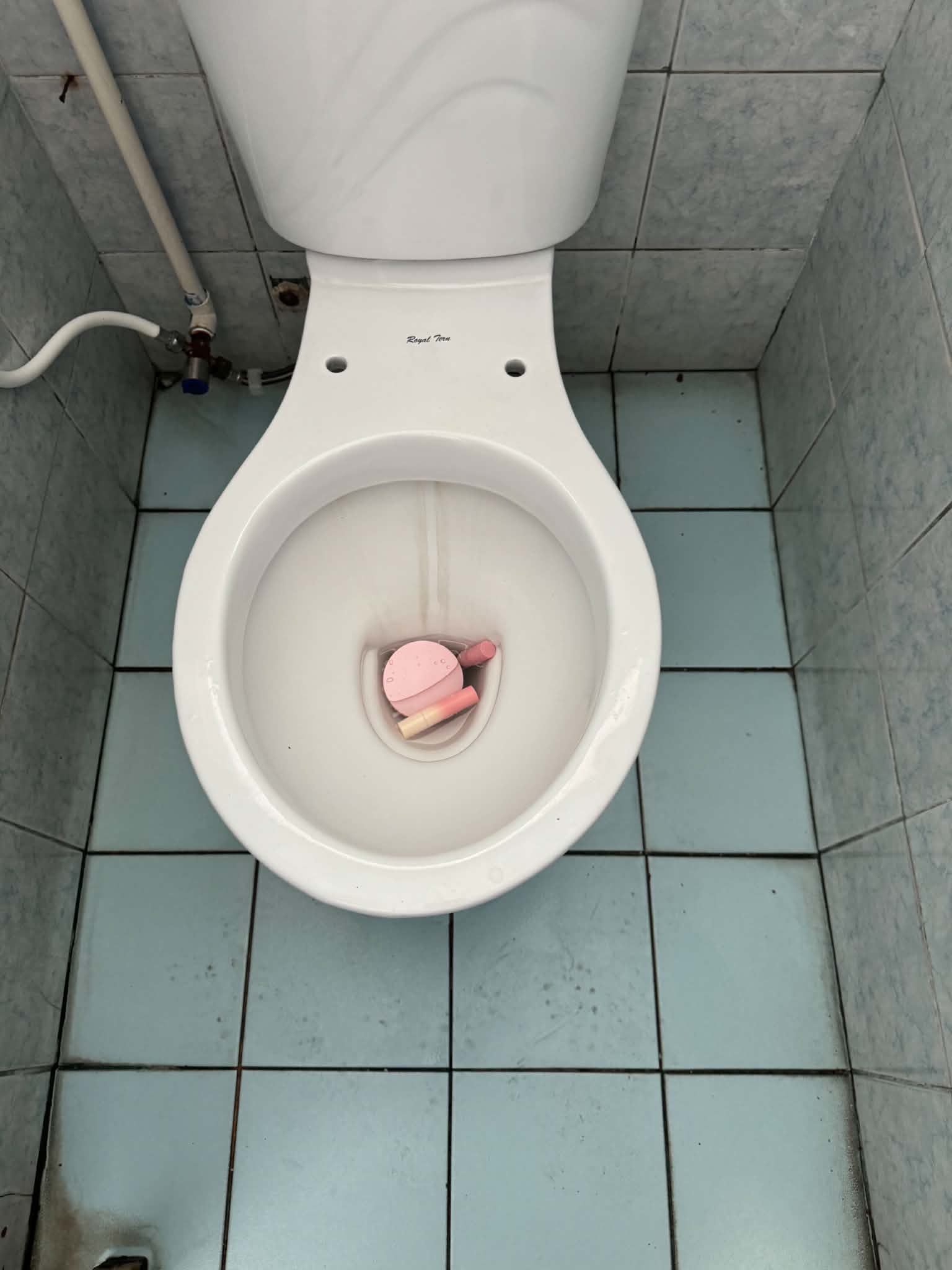 Missing school belongings discovered inside a toilet bowl